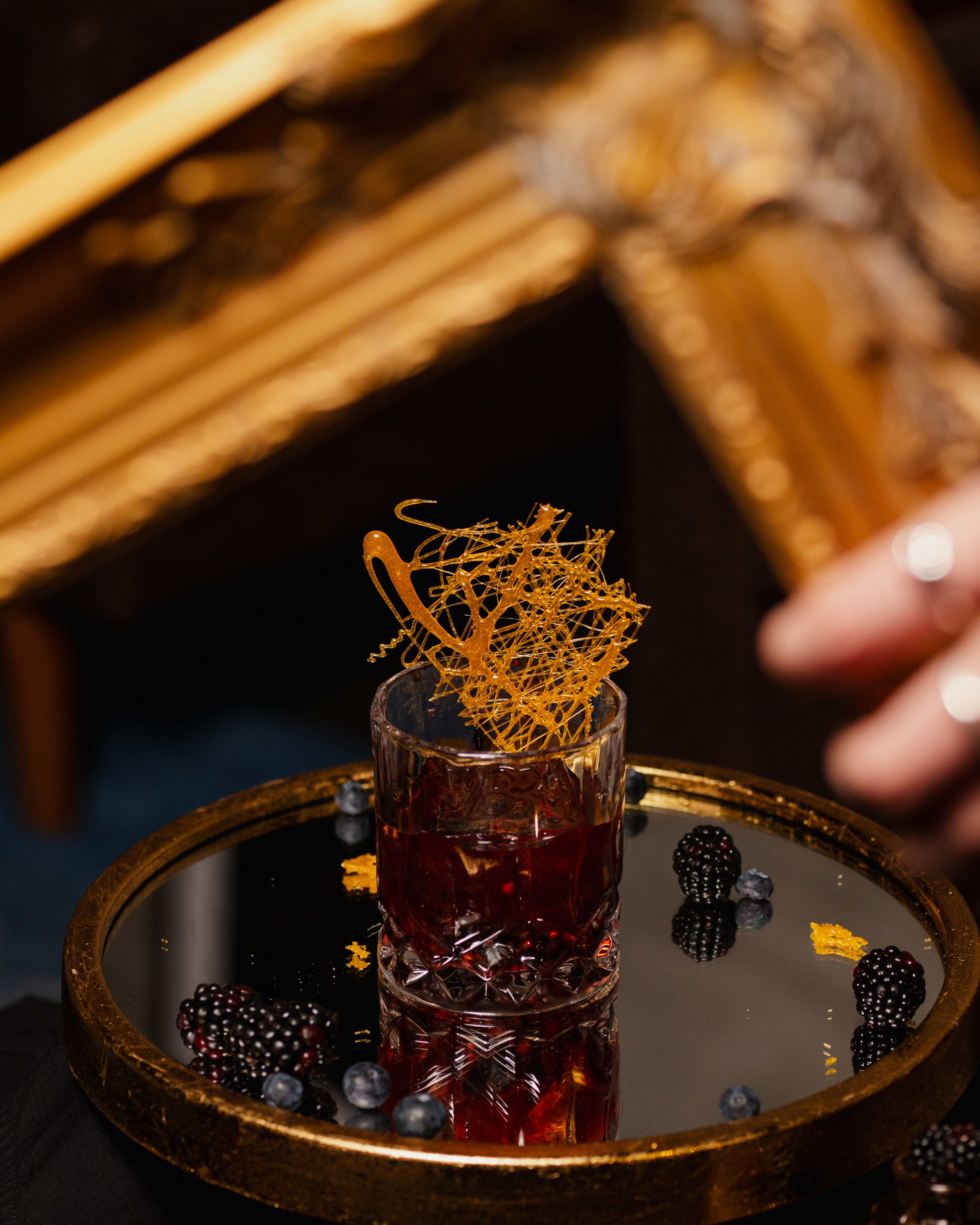 Craft cocktail on gold tray The Bunker San Antonio commercial photography