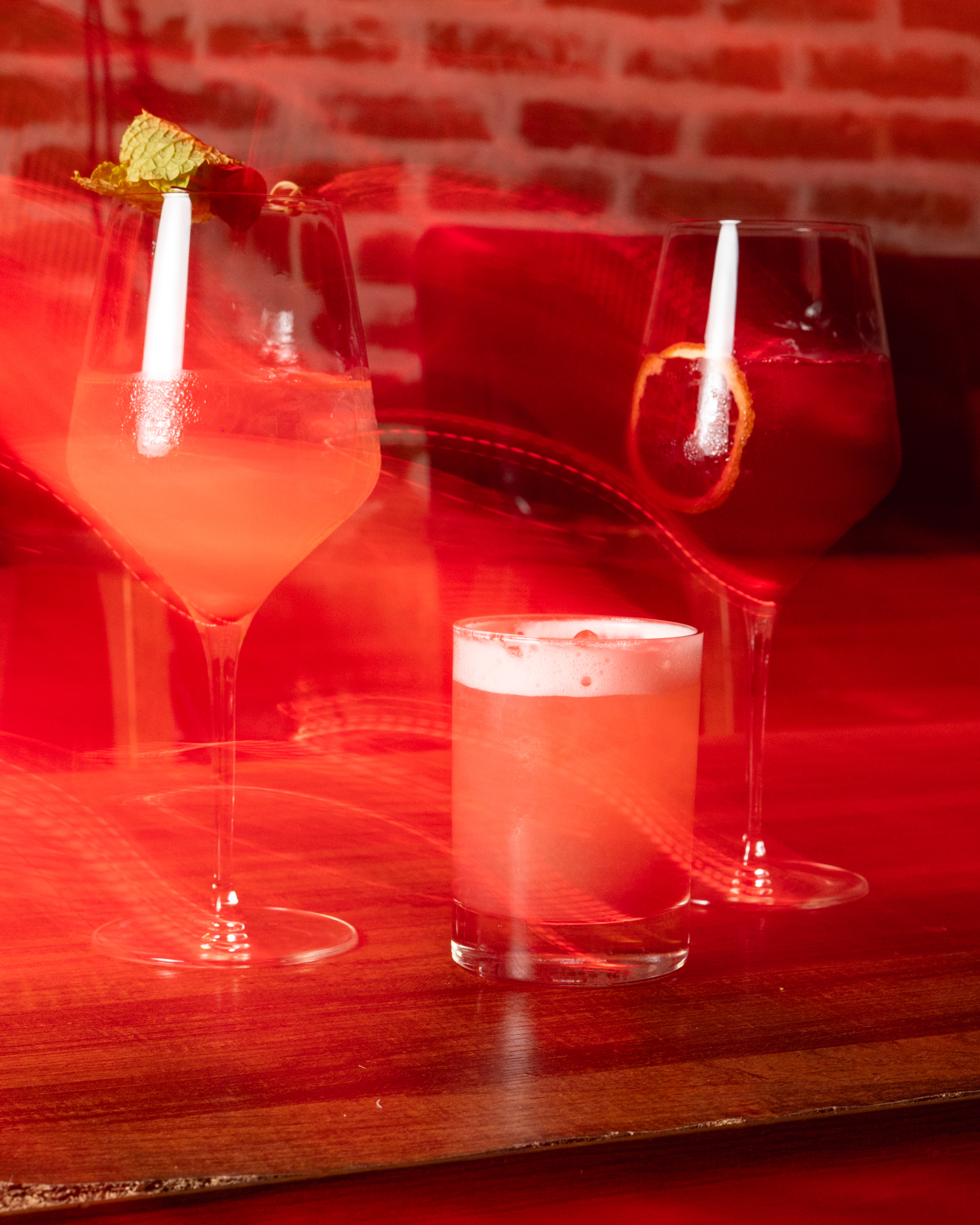 Moody red light cocktail bar photography The Cellar San Antonio